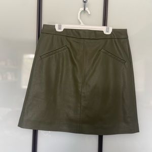 Green leather mini skirt